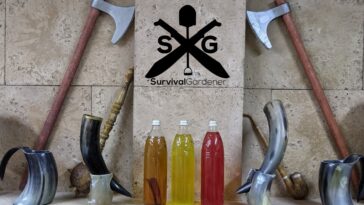 Mead bottles on display with drinking horns and battle axes
