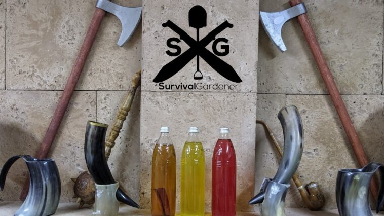 Mead bottles on display with drinking horns and battle axes