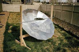 Parabolic solar cooker built onto wooden stand
